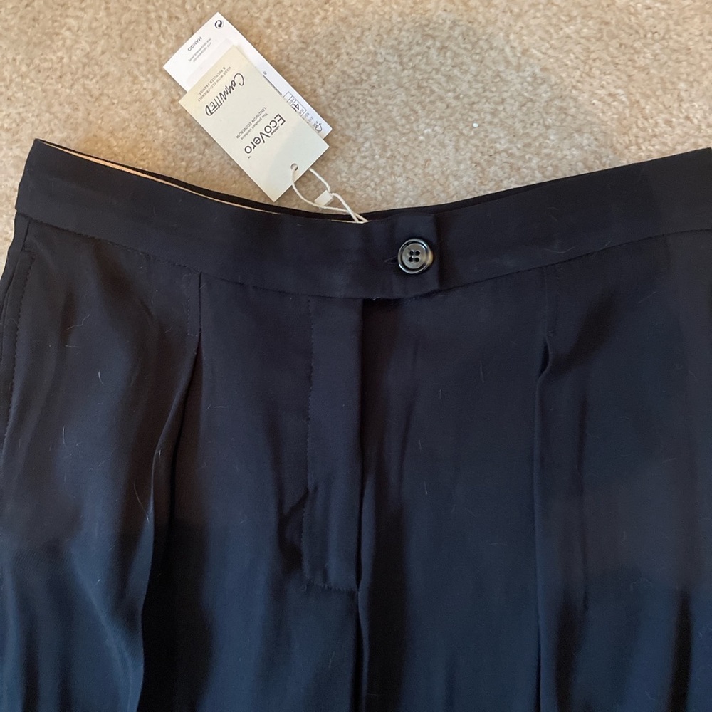 Black trousers never worn. Tags still intact.
